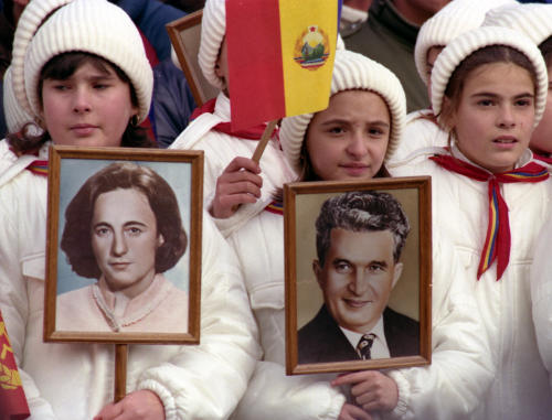 Romanian children with portraits of Ceausescus