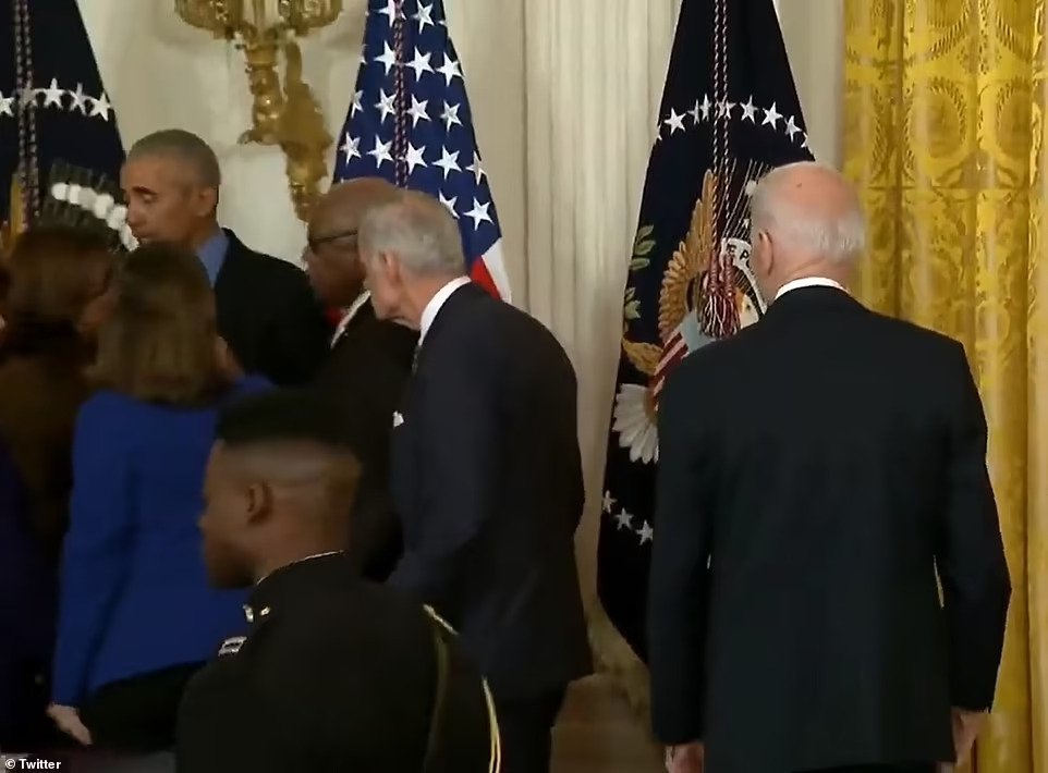 56272739-10720467-Obama_is_seen_to_the_side_chatting_with_fellow_politicians_while-a-4_1649985837715