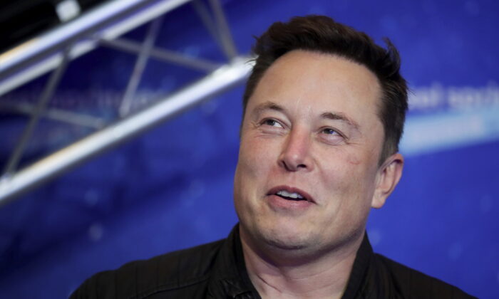 FILE - Tesla and SpaceX CEO Elon Musk arrives on the red carpet for the Axel Springer media award in Berlin on Dec. 1, 2020. For months, the Tesla and SpaceX CEO has expressed interest in creating his own version of China’s WeChat — a “super app” that does video chats, messaging, streaming and payments — for the rest of the world.. At least, that is, once he's done buying Twitter after months of legal infighting over the $44 billion purchase agreement he signed in April 2022. (Hannibal Hanschke/Pool Photo via AP, File)