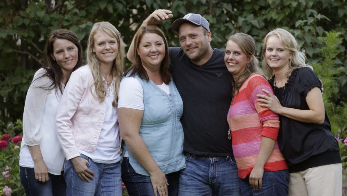 FILE - In this Sept. 11, 2013, file photo, Brady Williams poses with his wives, from left to right, Paulie, Robyn, Rosemary, Nonie, and Rhonda, outside of their home in a polygamous community outside Salt Lake City. Rosemary Williams says she was molested more than two decades ago by her father, Lynn A. Thompson. He is the leader of the one of largest organized polygamy groups in Utah, the Apostolic United Brethren, or AUB. (AP Photo/Rick Bowmer, File)