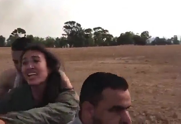76286559-12606047-Sitting_on_the_back_of_a_terrorist_s_motorcycle_her_outstretched-m-64_1696712257520