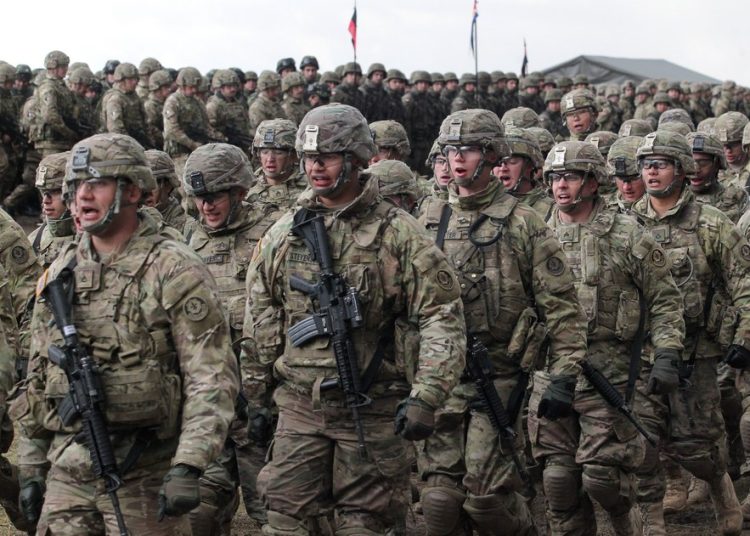 epa05906616 Soldiers of the 2nd Armored Cavalry Regiment of the US Army during welcome ceremony of the North Atlantic Treaty Organization (NATO) Enhanced Forward Presence (eFP) contingent in the Military Training Center of the Land Forces in Orzysz, north Poland, 13 April 2017. They will be stationed in Orzysz as part of reinforcement NATO's eastern flank. EPA/Tomasz Waszczuk POLAND OUT