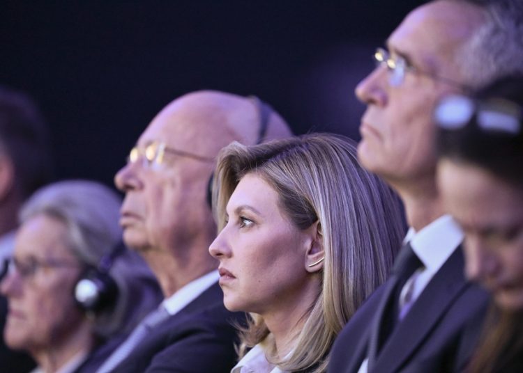 epa10413716 (R-L) Nato General Secretary Jens Stoltenberg, Ukrainian First Lady Olena Zelenska, WEF President Klaus Schwab, and his wife Hilde Schwab listen to Ukrainian President Zelenskyy (not pictured) as he delivers a speech by video conference during the 53rd annual meeting of the World Economic Forum (WEF) in Davos, Switzerland, 18 January 2023. The meeting brings together entrepreneurs, scientists, corporate and political leaders in Davos under the topic 'Cooperation in a Fragmented World' from 16 to 20 January. EPA/GIAN EHRENZELLER