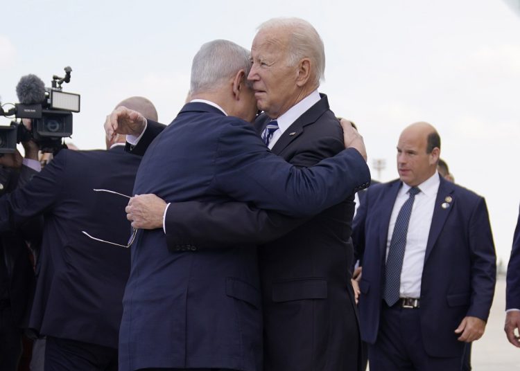 President Joe Biden is greeted by Israeli Prime Minister Benjamin Netanyahu after arriving at Ben Gurion International Airport, Wednesday, Oct. 18, 2023, in Tel Aviv. (AP Photo/Evan Vucci)