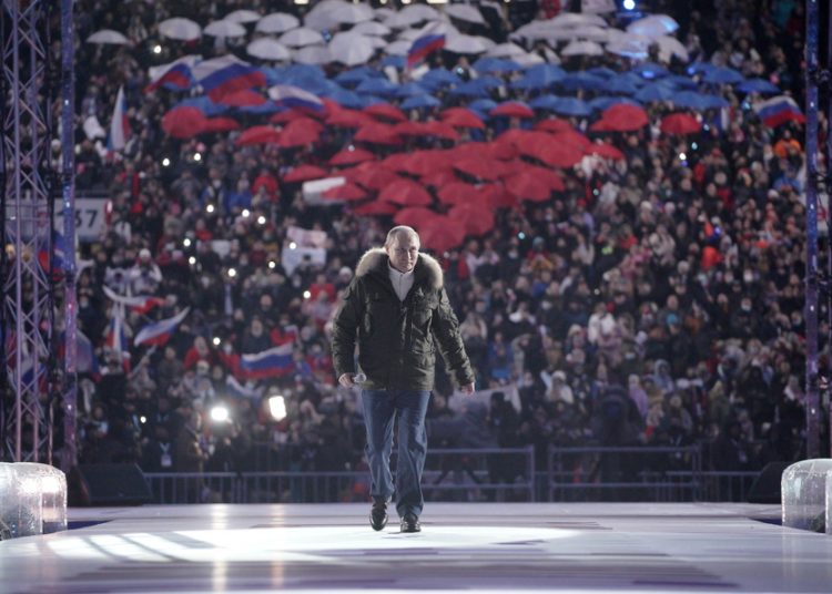 epa09082389 Russian President Vladimir Putin during the concert marking the seventh anniversary of the reunification of the Crimea with Russia, in Moscow, Russia, 18 March 2021.  EPA/ALEXEI DRUZHININ / SPUTNIK / KREMLIN POOL MANDATORY CREDIT