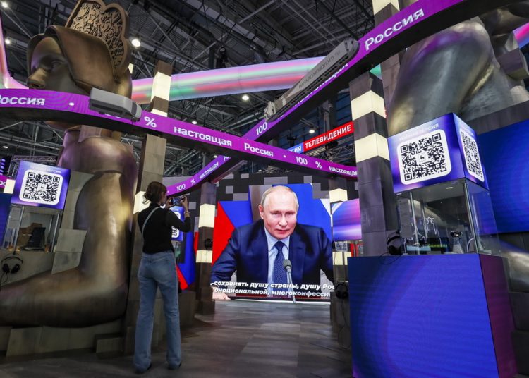 epa10976688 Russian President Vladimir Putin is shown speaking on a big screen during the International Exhibition-forum Russia in Moscow, Russia, 15 November 2023. The International Exhibition-forum Russia, designed to demonstrate Russian main achievements in technology, science, tourism and culture, runs from 04 November 2023 to 12 April 2024. EPA/YURI KOCHETKOV