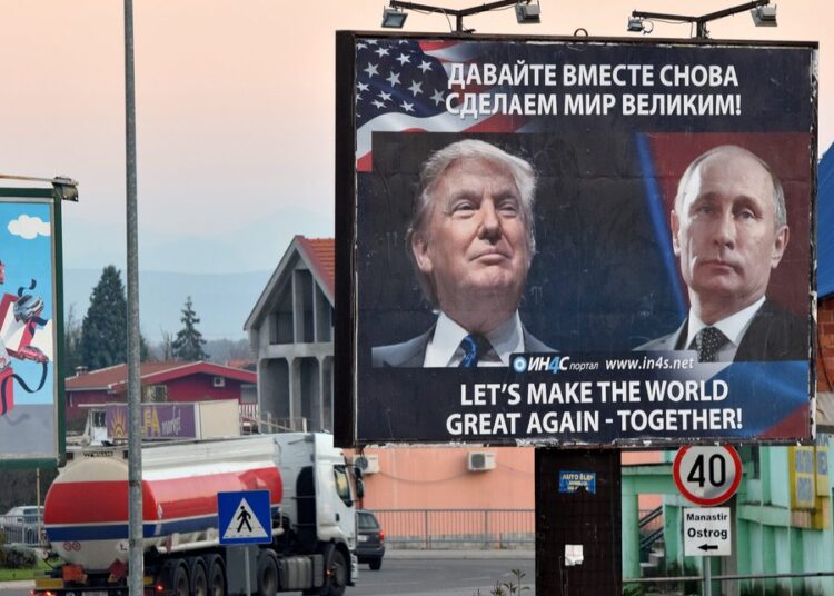 epa05634156 A billboard by pro-Serbian movement shows the image US President-elect Donald Trump and Russian President Vladimir Putin as a truck drives past in the town of Danilovgrad, Montenegro, 16 November 2016. Presidents Donald Trump and Vladimir Putin spoke by phone of better relations in the future between Washington and Moscow on 15 November.  EPA/BORIS PEJOVIC