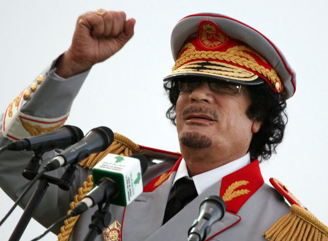 FILE - In this Saturday, June 12, 2010 file photo, Libyan leader Moammar Gadhafi talks during a ceremony to mark the 40th anniversary of the evacuation of the American military bases in the country, in Tripoli, Libya. The Associated Press is aware of reports that Moammar Gadhafi has been captured in Sirte. The chief spokesman for the revolutionary National Transitional Council Jalal el-Gallal and the council military spokesman Abdul-Rahman Busin told the AP that those reports are unconfirmed. (AP Photo/ Abdel Magid Al Fergany, File)