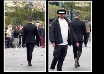 Ποιος είναι ο «Εκτελεστής» με το κοστούμι, τα μαύρα γάντια & την χειροβομβίδα στην χθεσινή συγκέντρωση των Τεμπών;